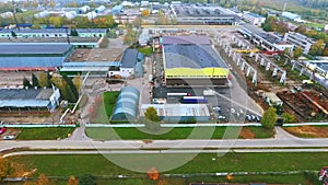 Drone view warehouse area on industrial plant. Industrial buildings sky view