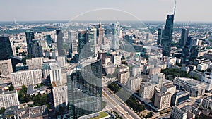 Drone view of Warsaw Poland cityscape with apartment buildings glass skyscrapers and Palace of Culture and Science in