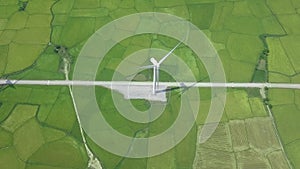 Drone view wind turbine on alternative energy station on green field. Alternative natural source and ecology