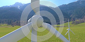 A drone view of a wind turbine installed in the forested mountains of the eastern Alps. Clean renewable energy available even at