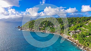 Drone viewpoint of beautiful Anse La Liberte\', Seychelles coastline on a sunny day