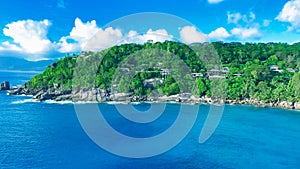 Drone viewpoint of beautiful Anse La Liberte\', Seychelles coastline on a sunny day