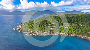 Drone viewpoint of beautiful Anse La Liberte\', Seychelles coastline on a sunny day