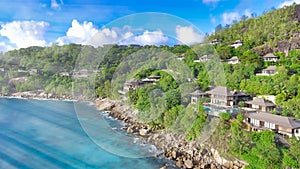 Drone viewpoint of beautiful Seychelles coastline on a sunny day