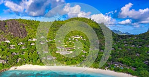 Drone viewpoint of beautiful Seychelles coastline on a sunny day