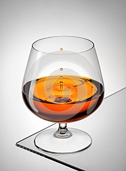 A drop of cognac in a glass