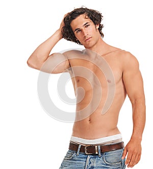 Drop-dead gorgeous. Studio portrait of handsome bare-chested young man  on white.