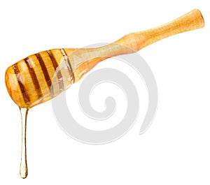 Drop honey on wooden dipper