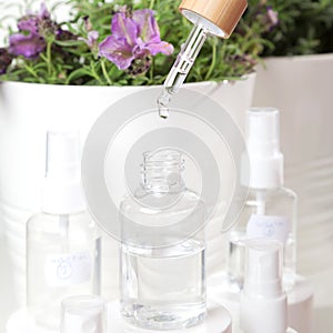 Drop of lavender essential oil from pipette