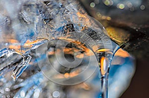 Drop of melting ice water from drainpipe