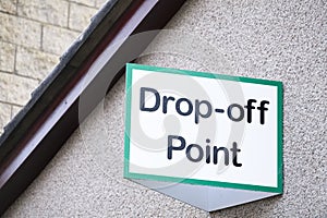 Drop off point sign for charity shop donation and recycle yard for goods toys food bank and clothes for welfare and the poor