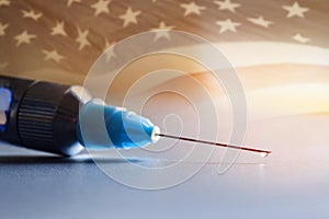 Drop on the tip of the syringe