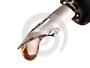 Drop of transparent color water on tip of pen photo