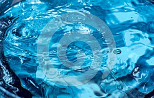 Drop of water. Blue water drop. Falling water. Water splash close-up
