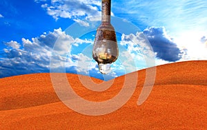 Drop of water hanging above the desert