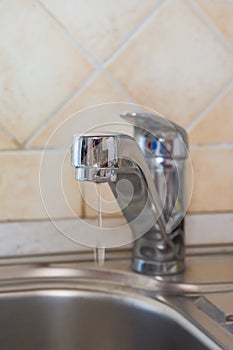 A drop of water on a tap