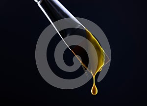 Macro image of yellow paint dripping from a paint brush