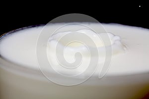 Droplet of milk in a glass