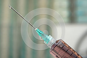 Droplet on the Point of Hypodermic Needle