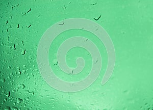 Droplets on light green background