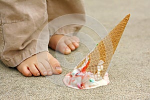 Dropped Ice Cream Cone by Child's Feet photo