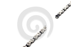 a dropped link of a bicycle chain, the weakest link, a broken chain