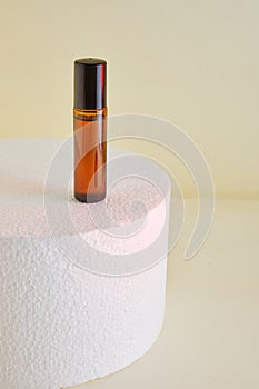 Dropper Bottle - Amber Glass for unlabelled perfume bottles on white podium