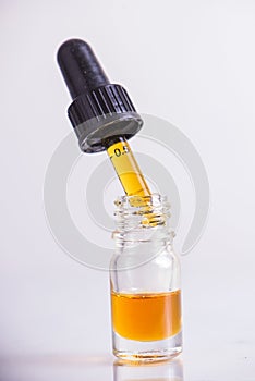 Dropper with CBD oil, cannabis live resin extraction isolated