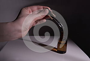 Dropper glass Bottle Mock-Up. Ð¡osmetic pipette on abstract background