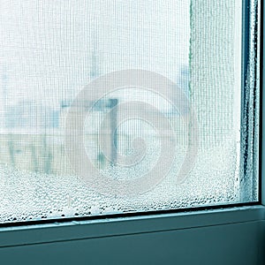 Drops of condensation in winter on the window