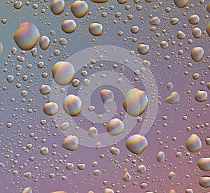 Drops on glass of different sizes and colors on a colored background, texture