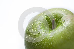 Drops on a green apple