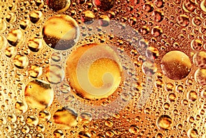 Drops of oil and air bubbles on water