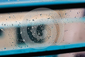 Drops of rain on blue glass background. drops on glass after rain for wallpaper. Drops on glass, window condensation.