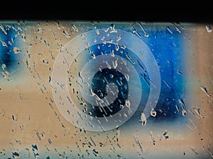 Drops of rain on blue glass background. drops on glass after rain for wallpaper. Drops on glass, window condensation.