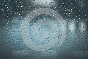 Drops Of Rain On Blue Glass Background