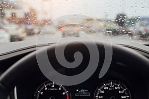 Drops Of Rain Drizzle on the glass windshield in the evening.