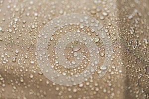 Drops of rain, water on a waterproof fabric close-up