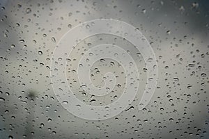 Drops of rain on a window pane. Shallow depth of field.