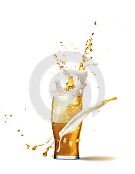 Drops and splashes. Full glass of frothy light lager beer isolated over light background. Concept of alcohol