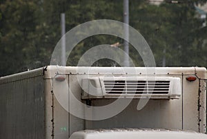 Drops of torrential rain falling on the roof of a truck