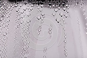 Drops and trickles of water on the glass photo