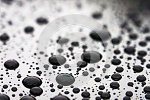 Drops of water on the car roof, nature background close up