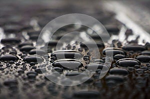 Drops of water on the car roof, nature background close up