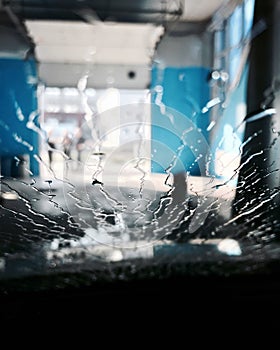 Drops of water flow down the car windshield