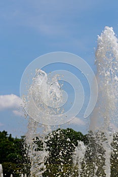 Drops of water in fountain in sunny day