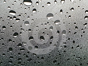 Drops of water and glass is frosted on the windshield