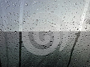 Drops of water and glass is frosted on the windshield