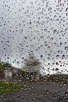 Drops of water on the glass on a rainy day, glass with drops of water