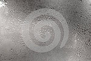 Drops of water on polished metal